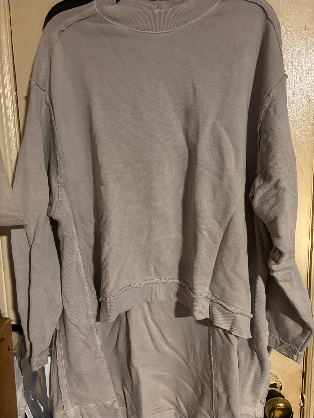 Free People taupe color high low sweatshirt with a high neckline long sleeve